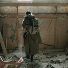 Who are preppers, prepared person standing in a derelict building