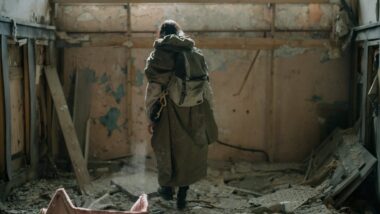 Who are preppers, prepared person standing in a derelict building